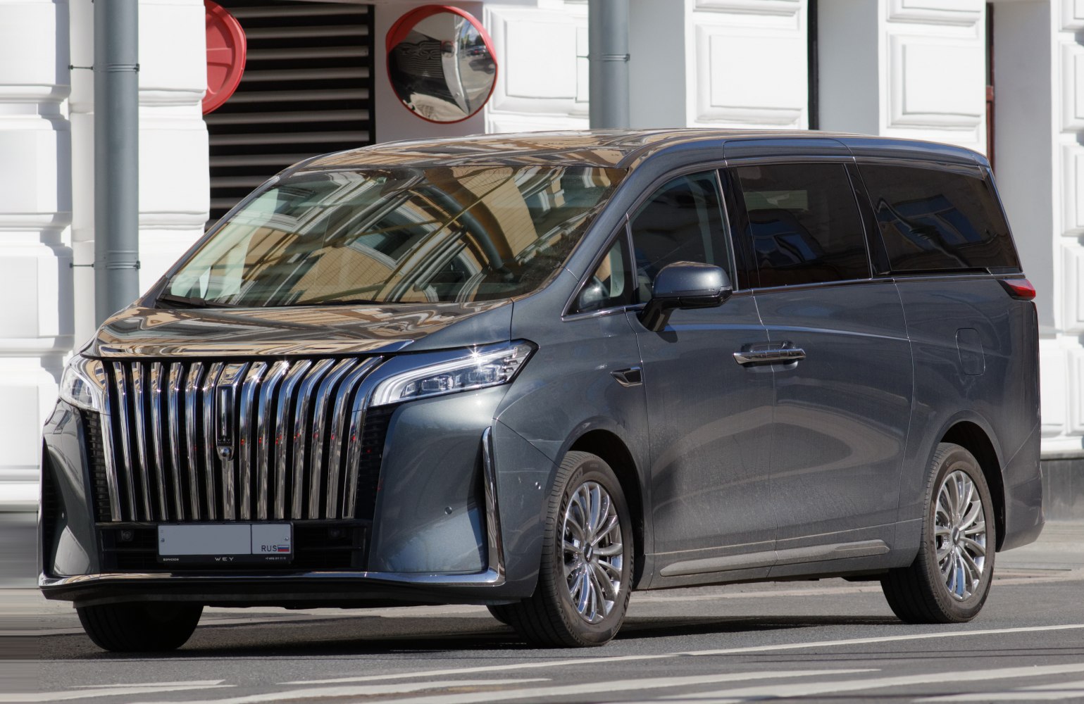 Luxury MPV with bold vertical grille and sleek LED headlamps