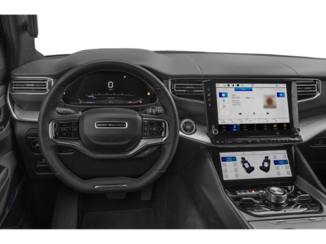 Dashboard with dual infotainment screens and multifunction steering wheel