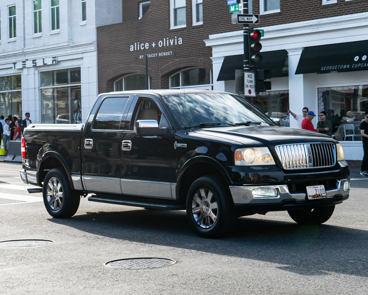 Crew cab pickup with chrome grille and wheels