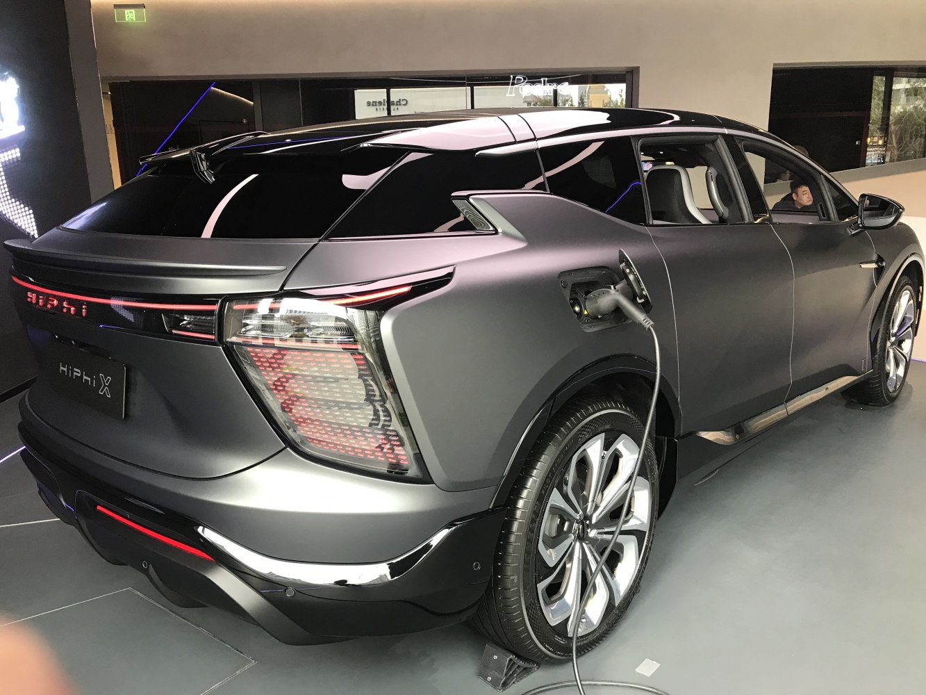 Rear view with charging port and modern taillights of an electric SUV