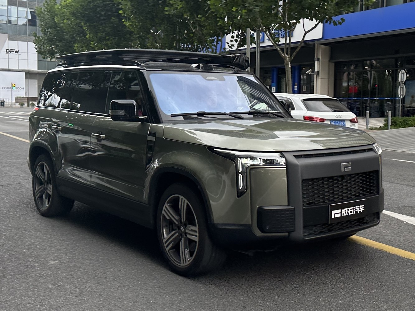 Modern boxy SUV design with roof rack and LED lights