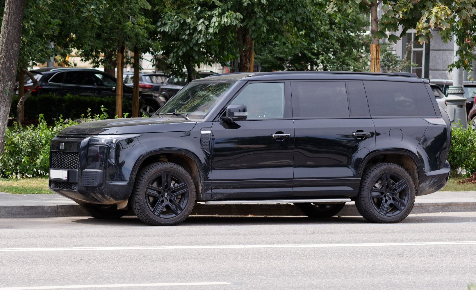 Large black full-size SUV side profile with distinct modern design