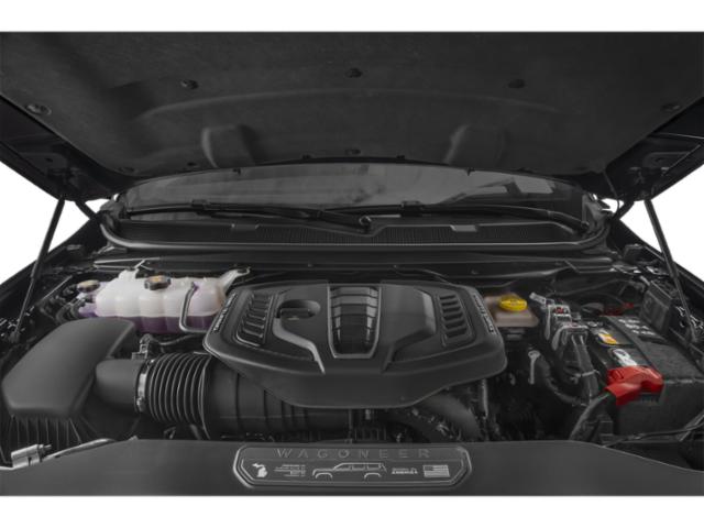 Modern engine bay with covered engine and visible components
