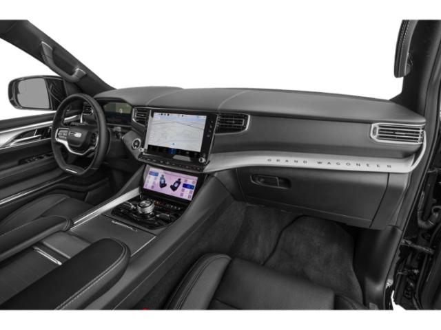Luxury SUV interior with dual touchscreen infotainment and modern dashboard design
