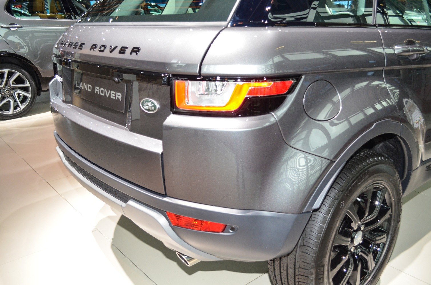 Rear end with taillight, fuel cap, bumper, and black alloy wheel