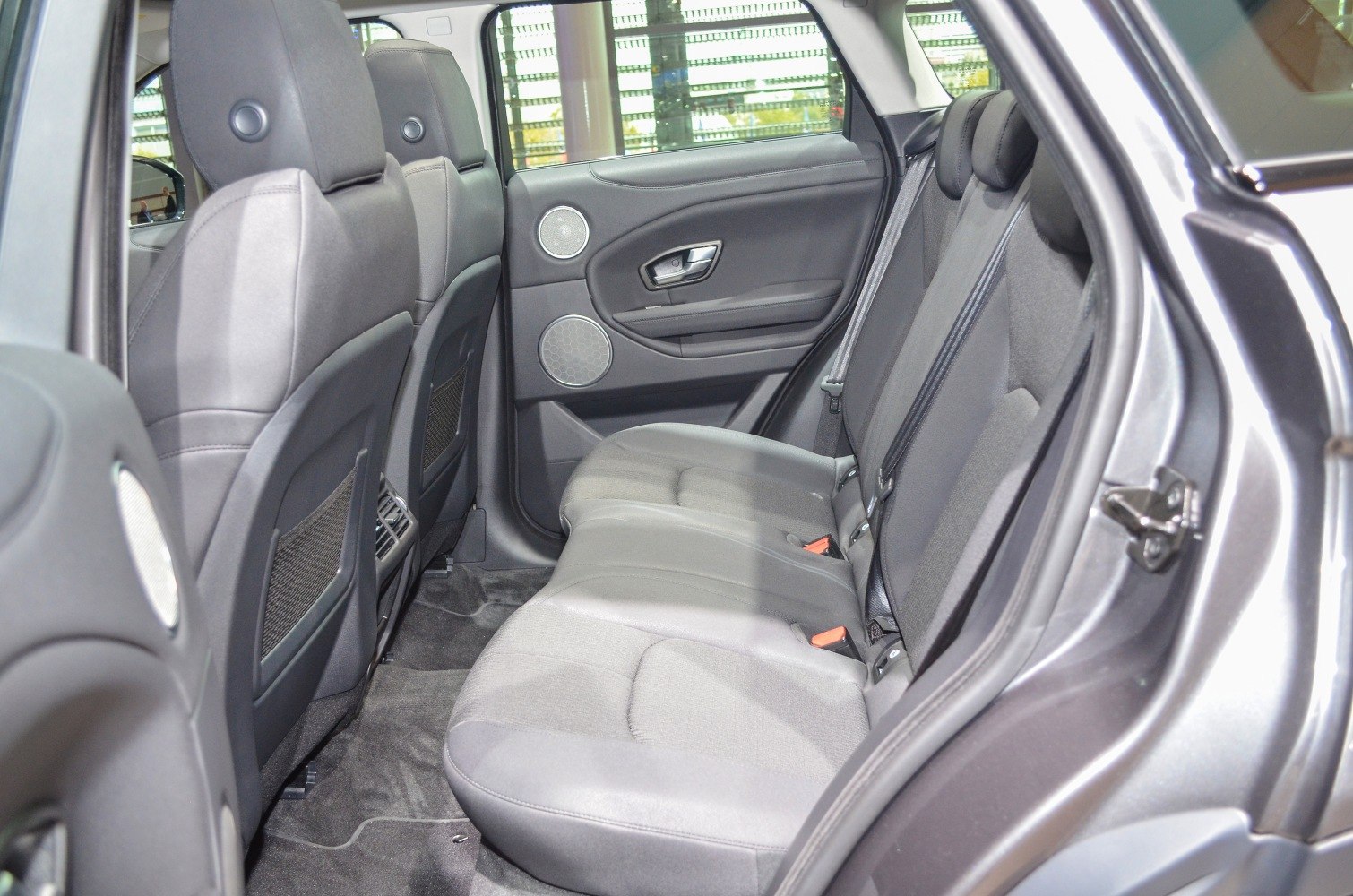 Rear seating area with door panel and upholstery details
