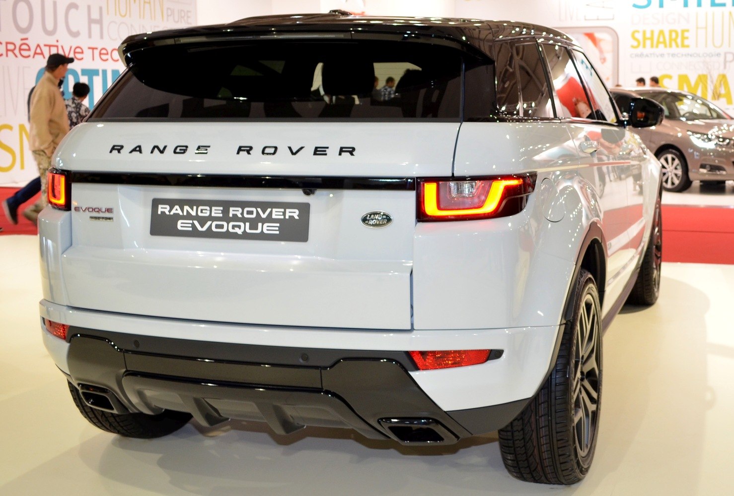 Rear view with LED taillights and dual exhaust of modern SUV