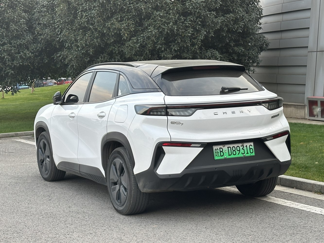 Rear and side view of a modern electric SUV with aerodynamic styling