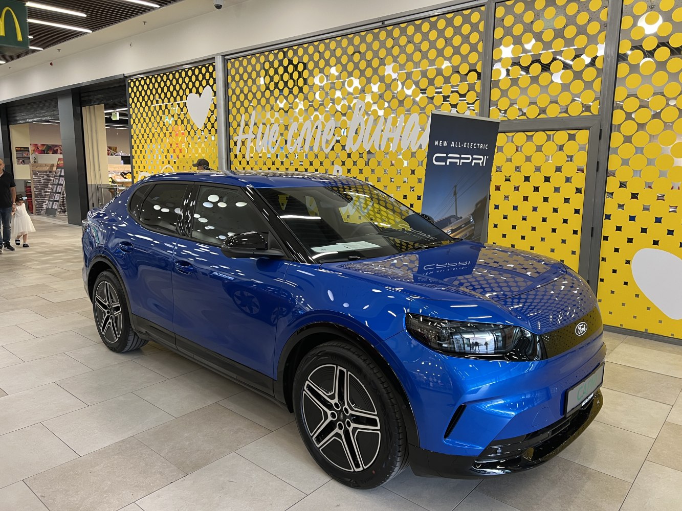 Blue all-electric SUV with modern design and alloy wheels
