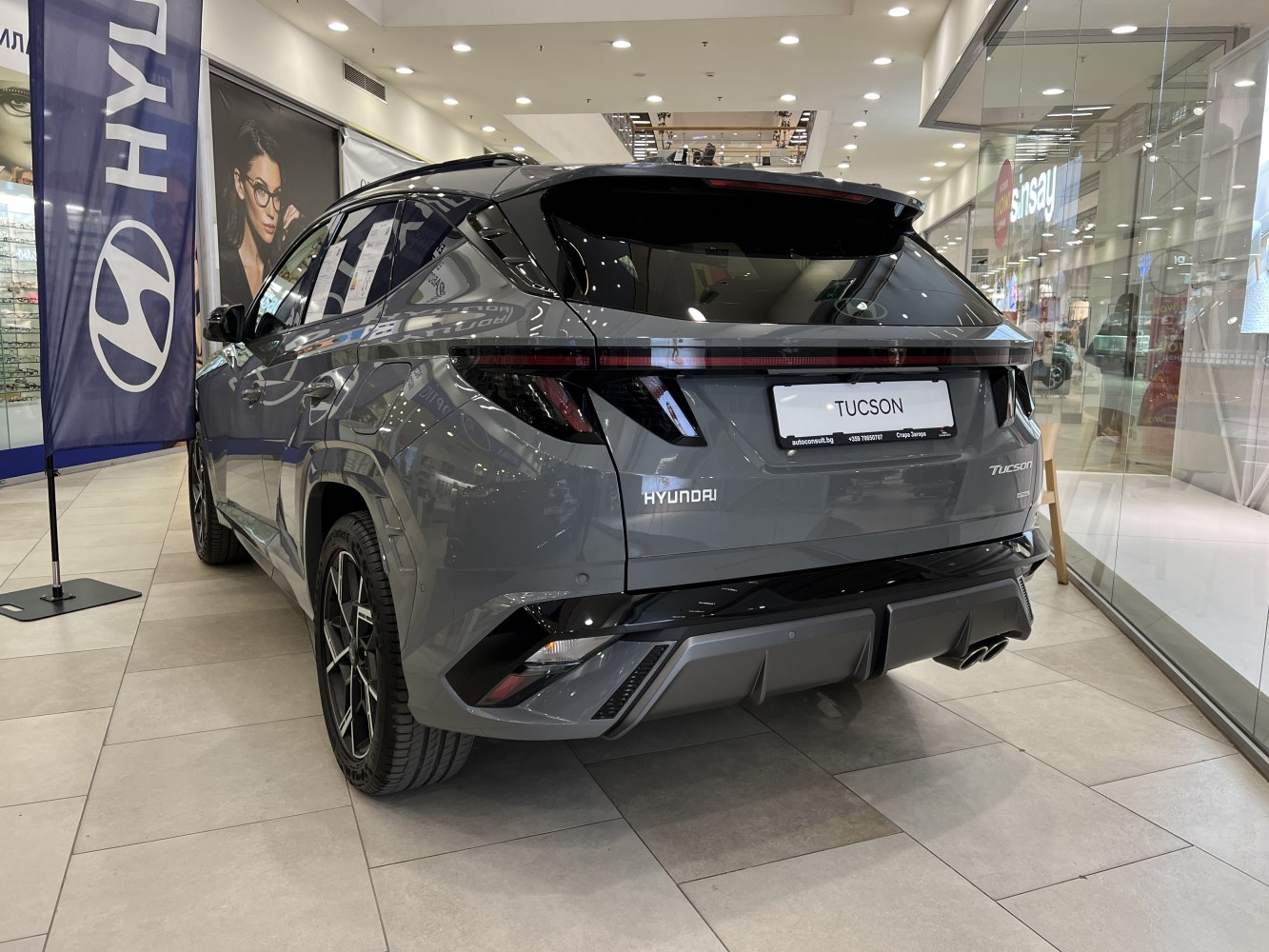 Rear view of 2024 Hyundai Tucson IV facelift with modern taillights and sporty bumper
