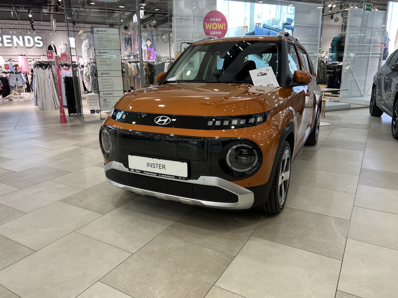 Front view with circular headlights and black grille