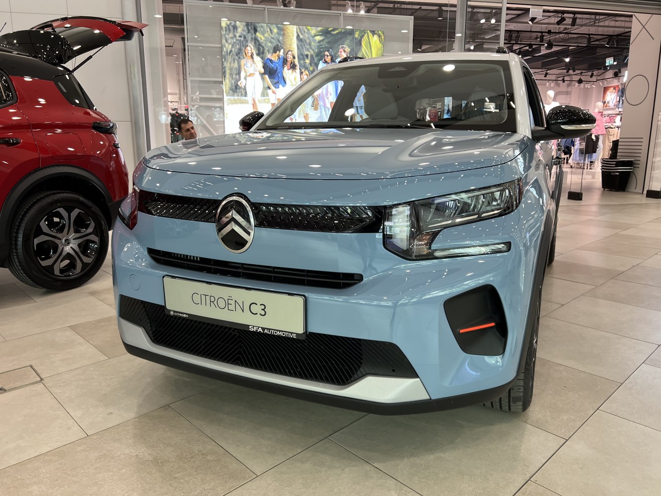 Modern front view with sleek grille and distinctive headlights