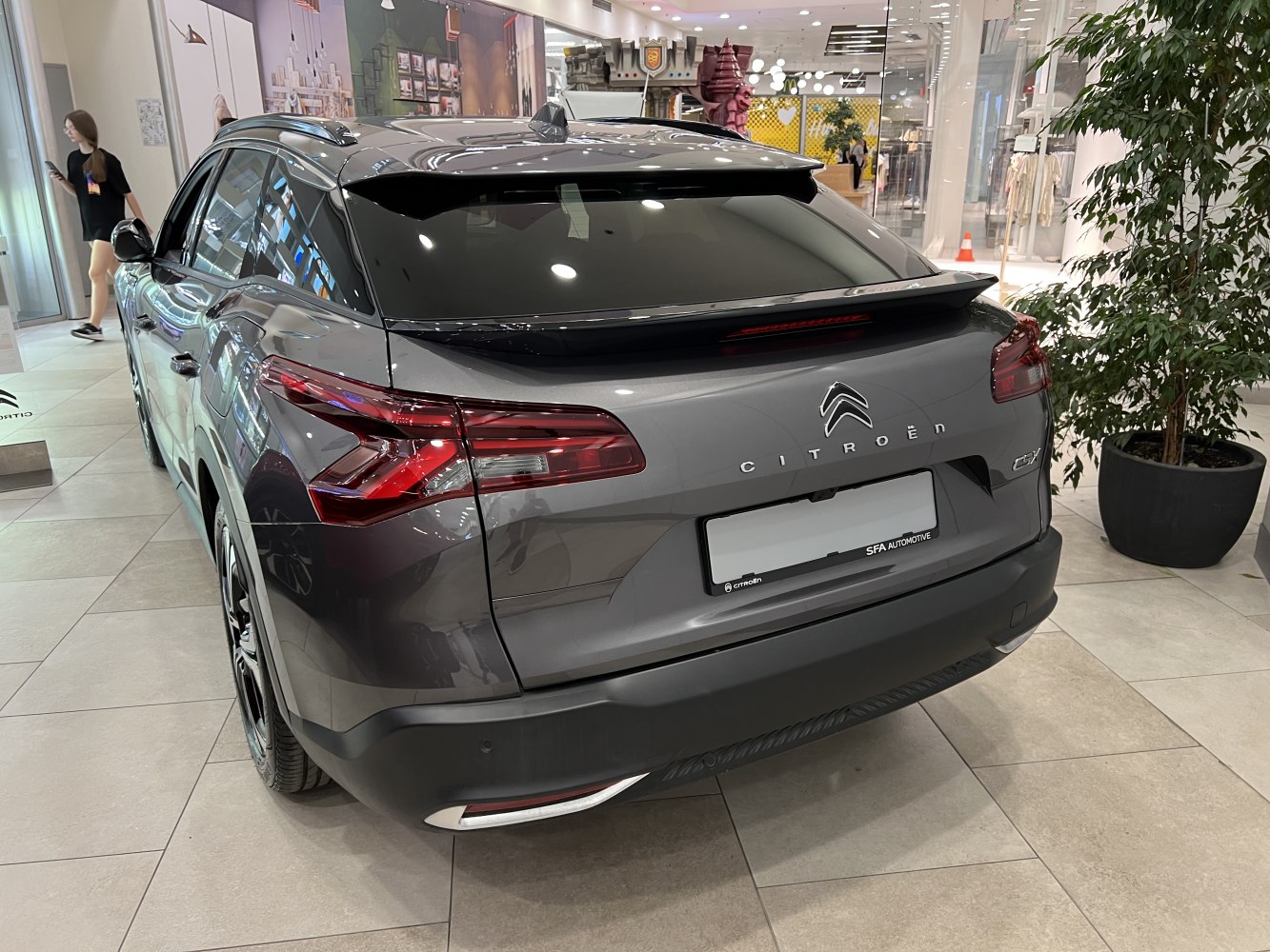 Sleek rear view with distinctive taillights and rear spoiler