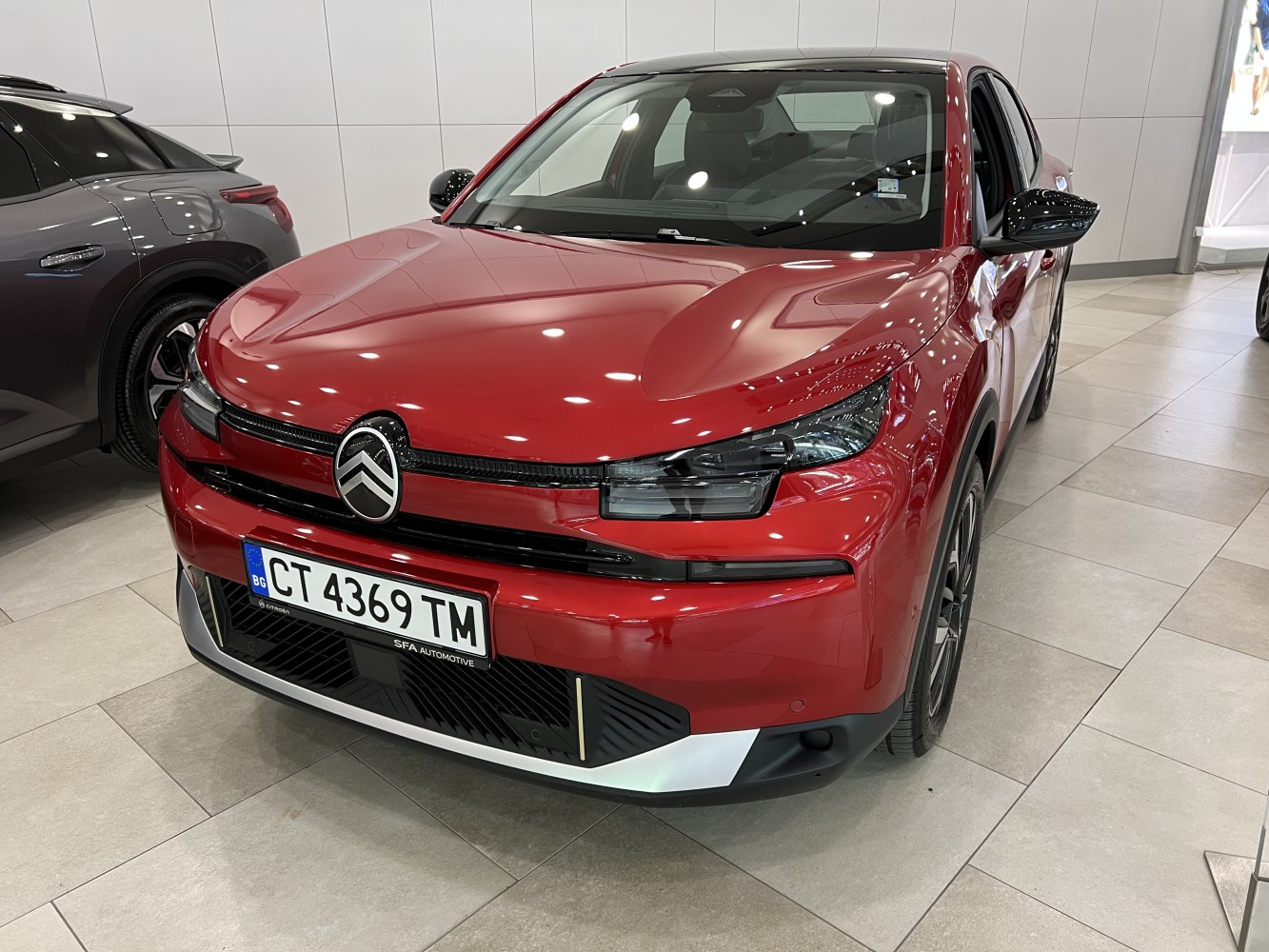 Front view with modern headlights and grille