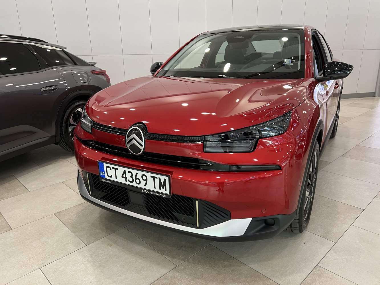 Front view with distinctive headlights and grille