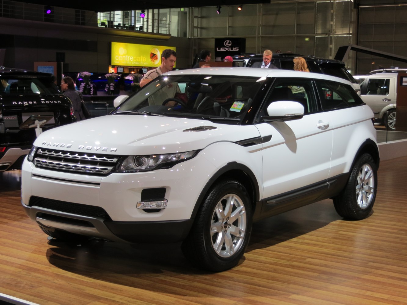White coupe SUV front and side view with signature grille and alloy wheels