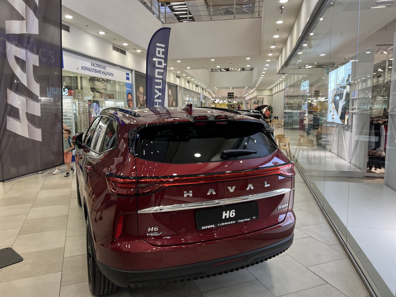 Rear view of SUV with LED taillights and hybrid badge