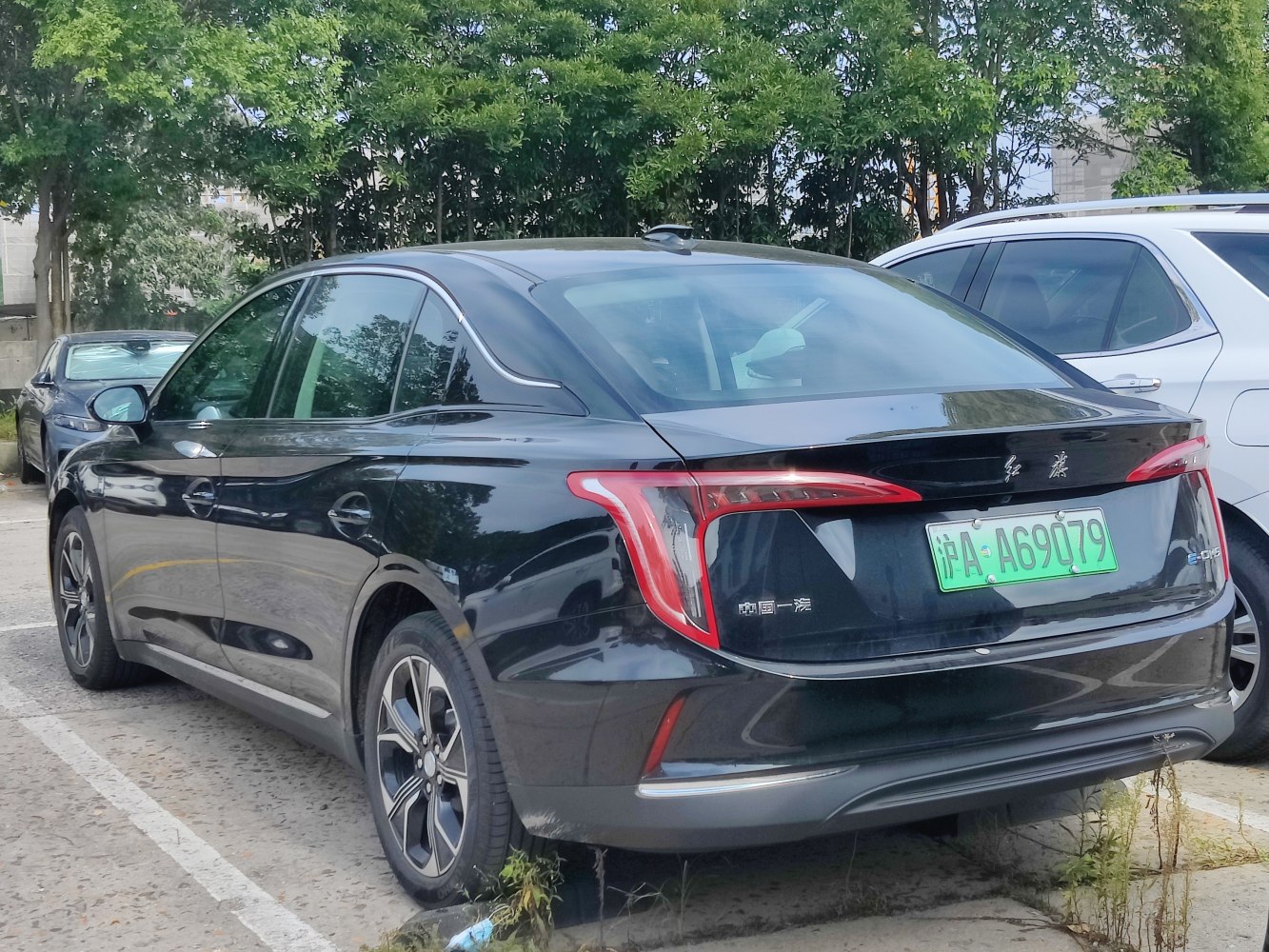 Rear view of sedan with prominent LED tail lights and smooth aerodynamic shape