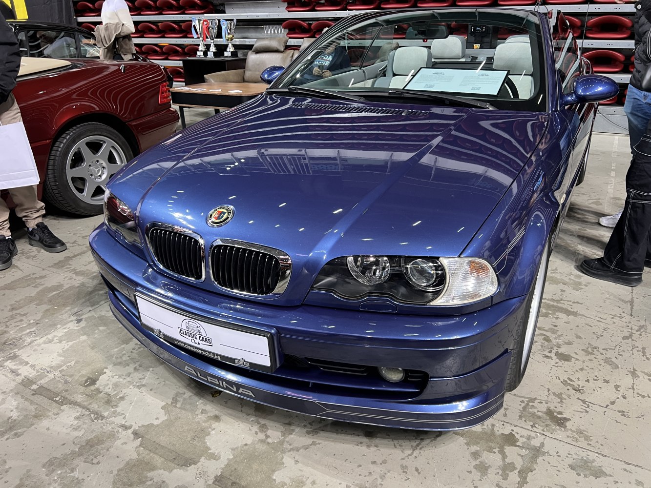 Front view of blue convertible with Alpina grille and headlights