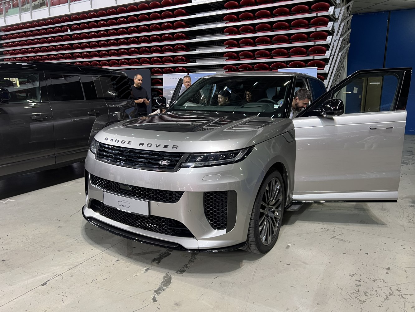 Front and side view of a luxury SUV with sporty grille and modern headlights
