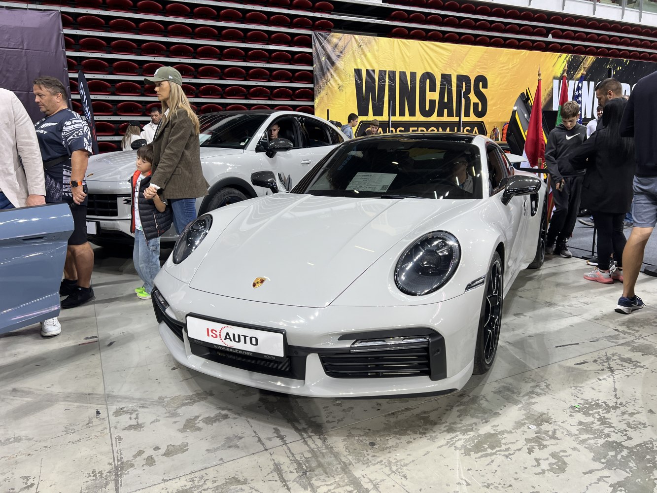 Front view of white sports coupe with round headlights