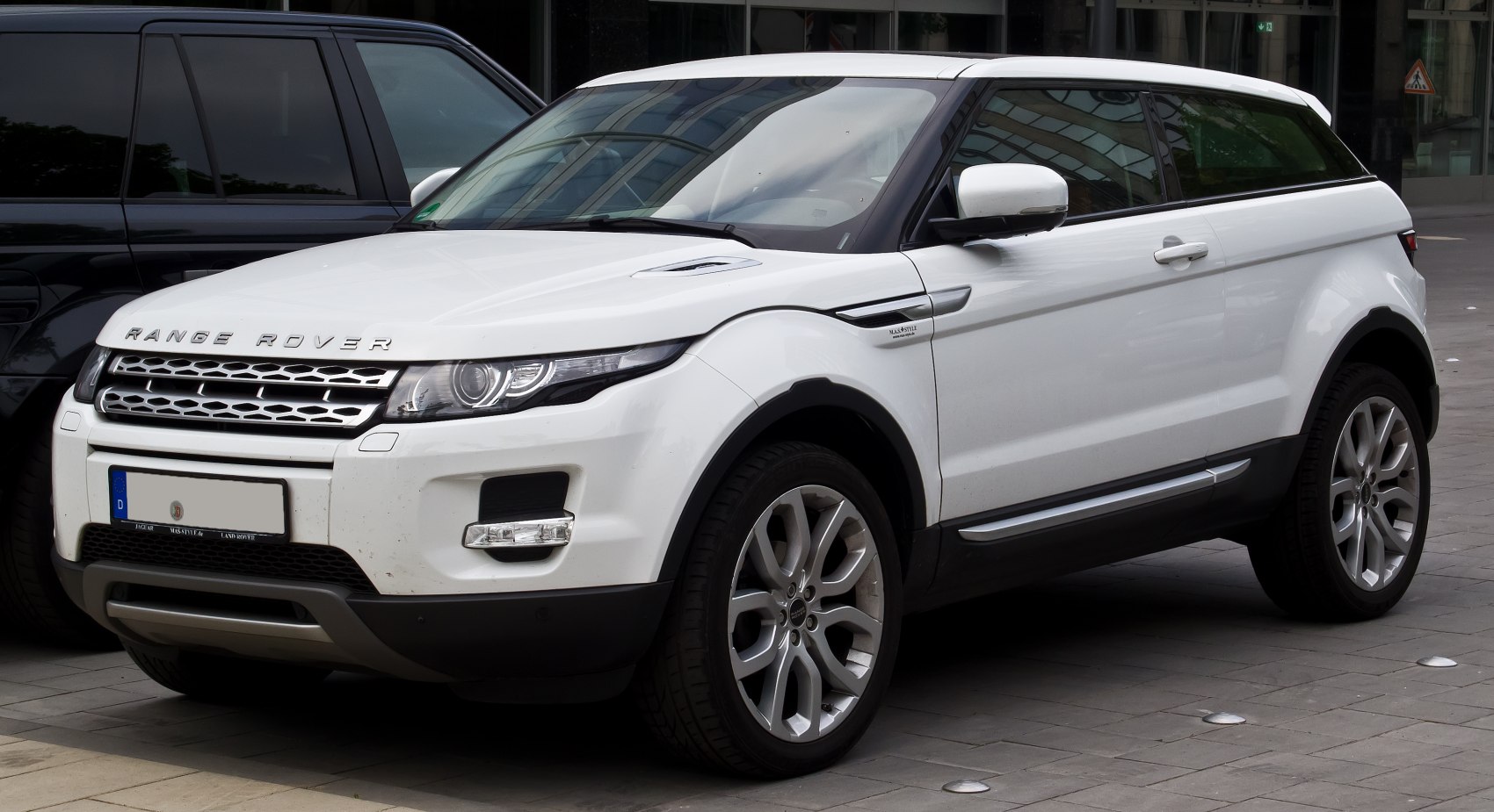 Compact luxury coupe SUV with sharp LED headlights and sporty silhouette