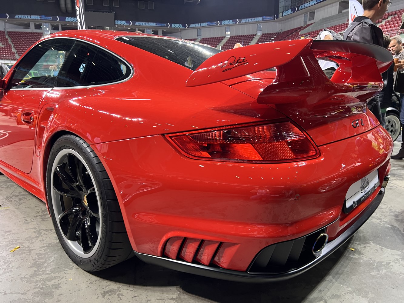 Wide body red Porsche 911 GT2 rear with spoiler and black wheels