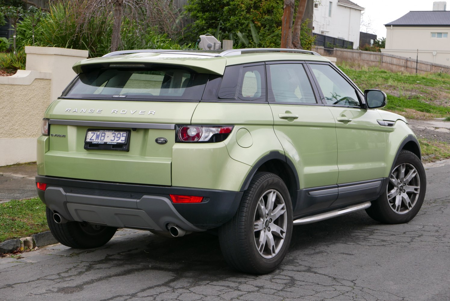 Rear and side exterior view of mid-size luxury SUV