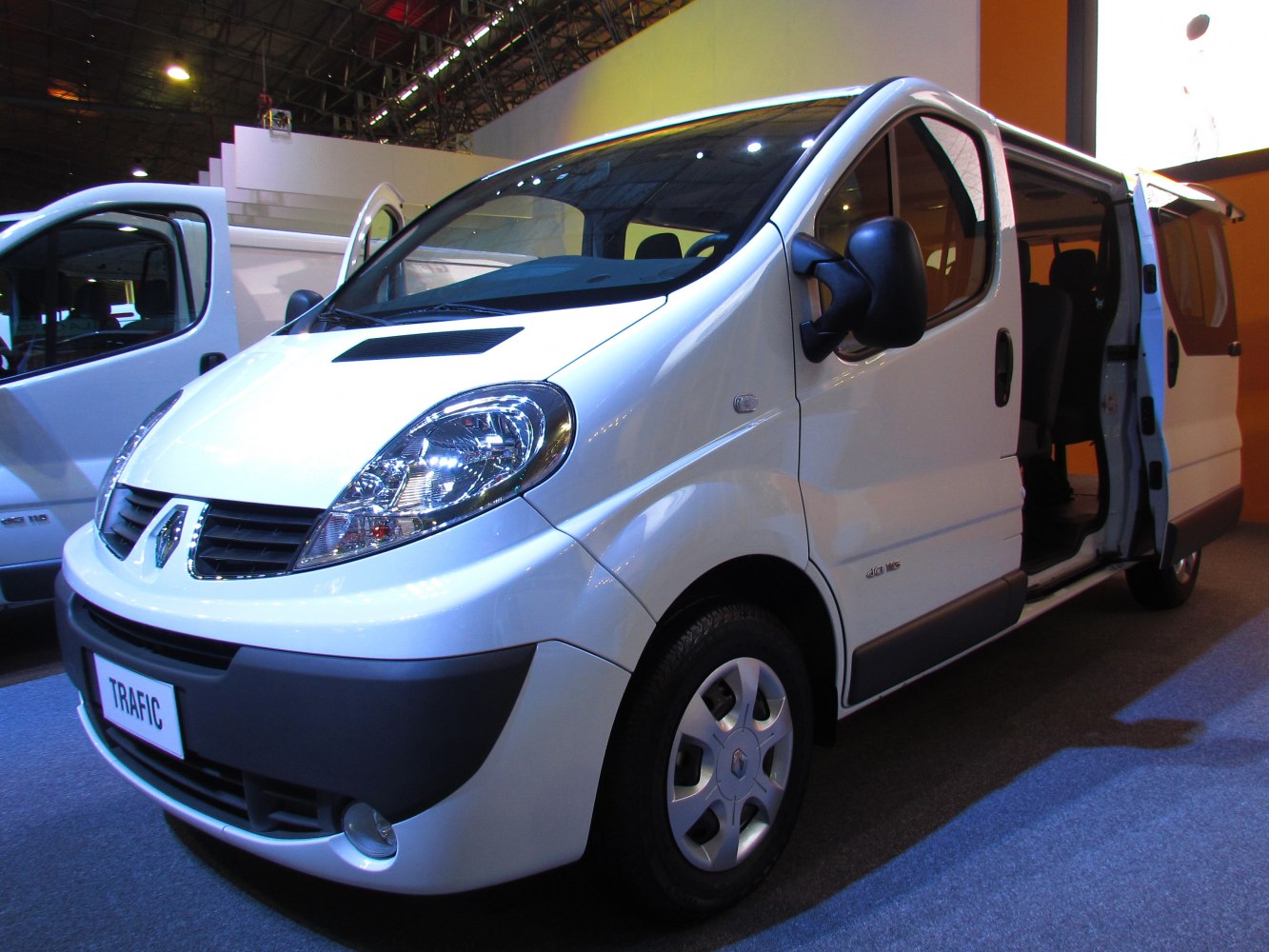 Front and side view of a 2006 van with sliding door and modern headlights