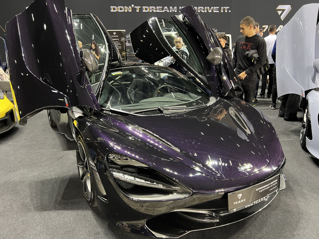 Supercar with distinctive butterfly doors and aerodynamic design