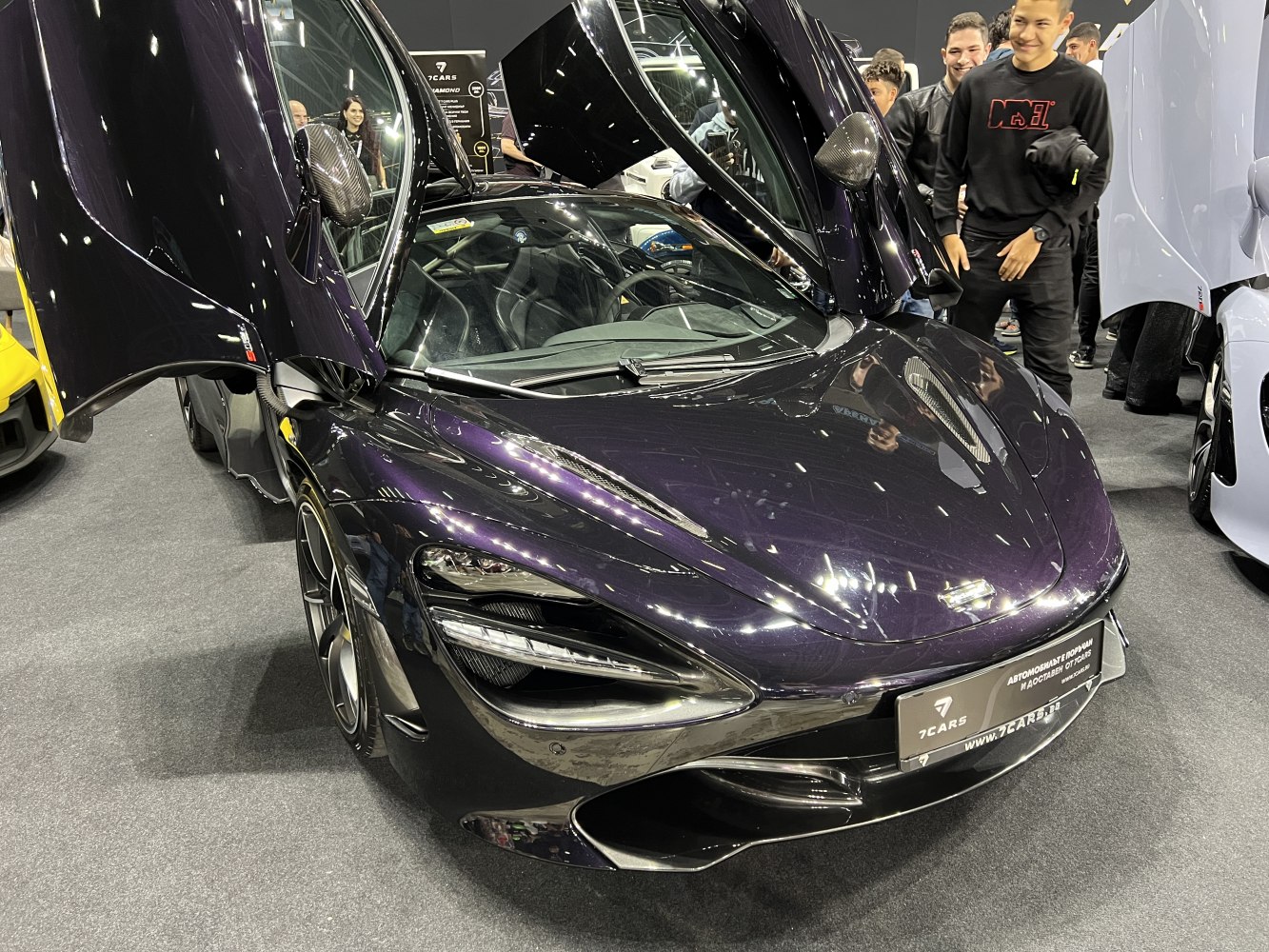 Butterfly doors and aerodynamic hood with sleek black finish