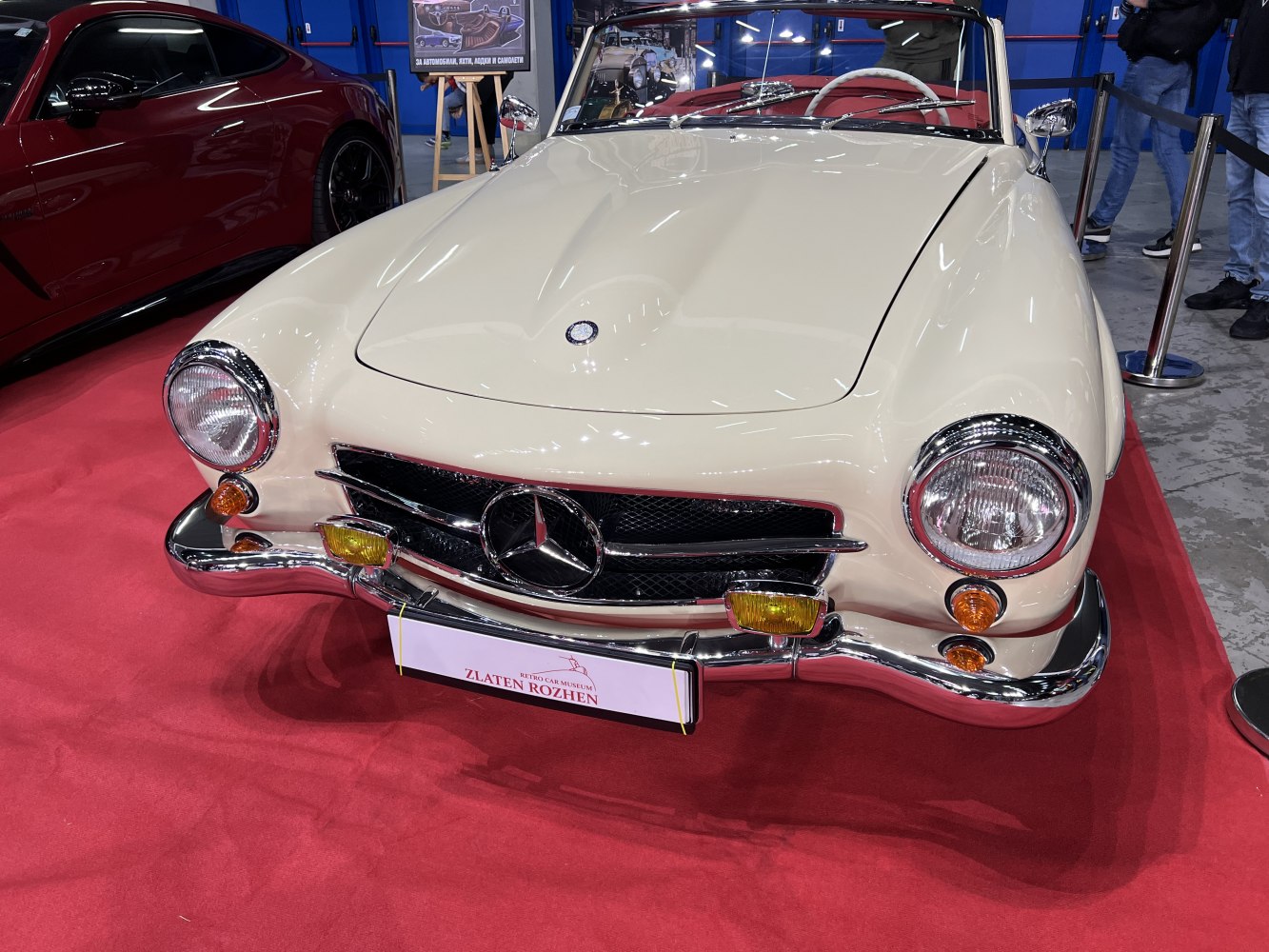 Vintage convertible front with round headlights and chrome grille