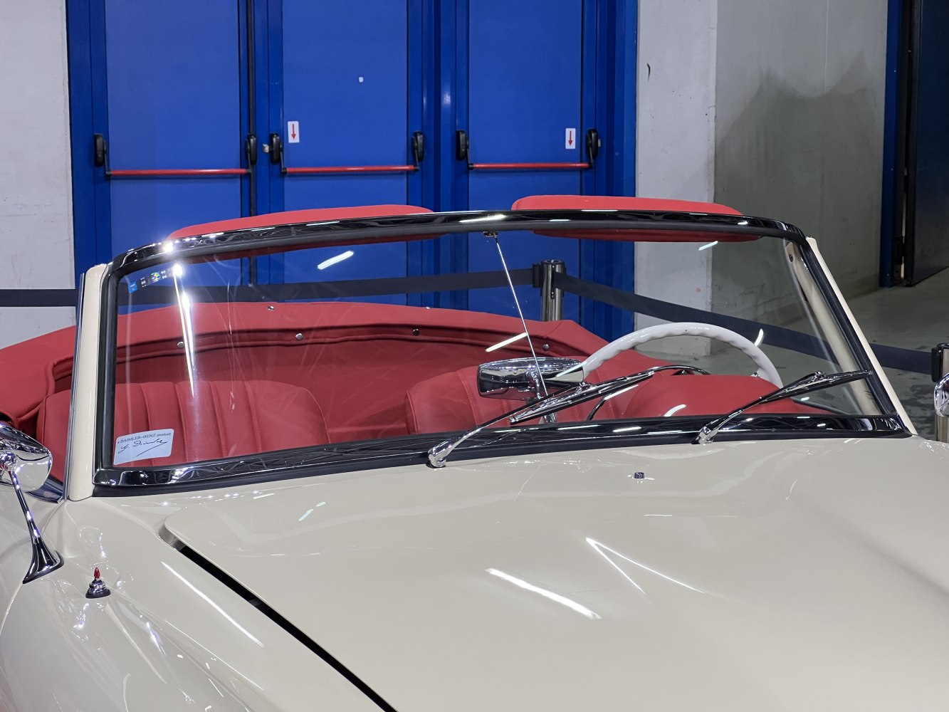 Convertible windshield, red leather seats, chrome trim