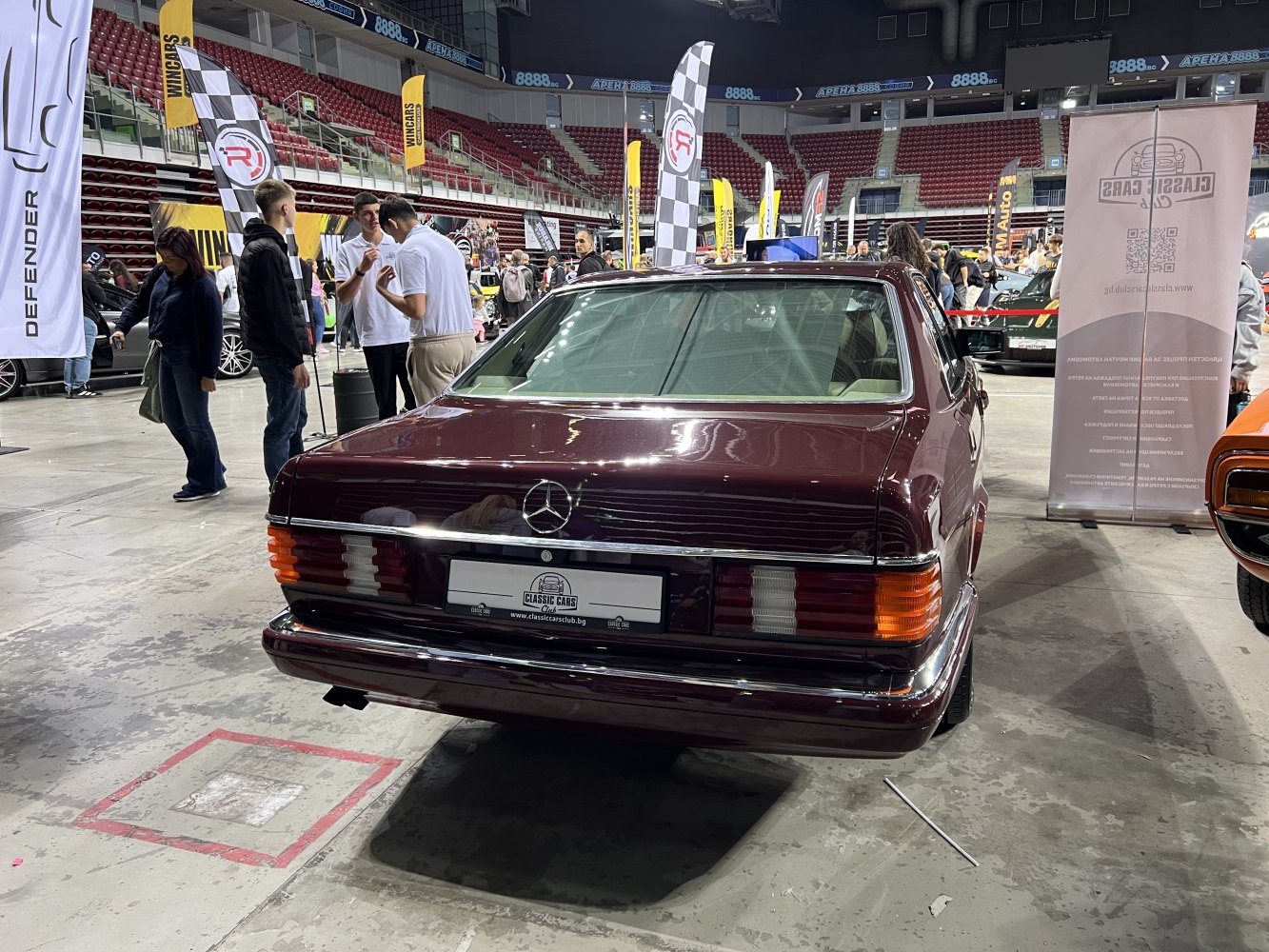 Rear view of classic luxury coupe with distinctive taillights and emblem