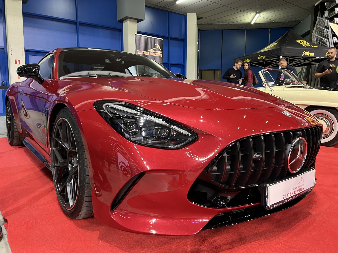 Close-up front view showing sleek headlights and vertical grille