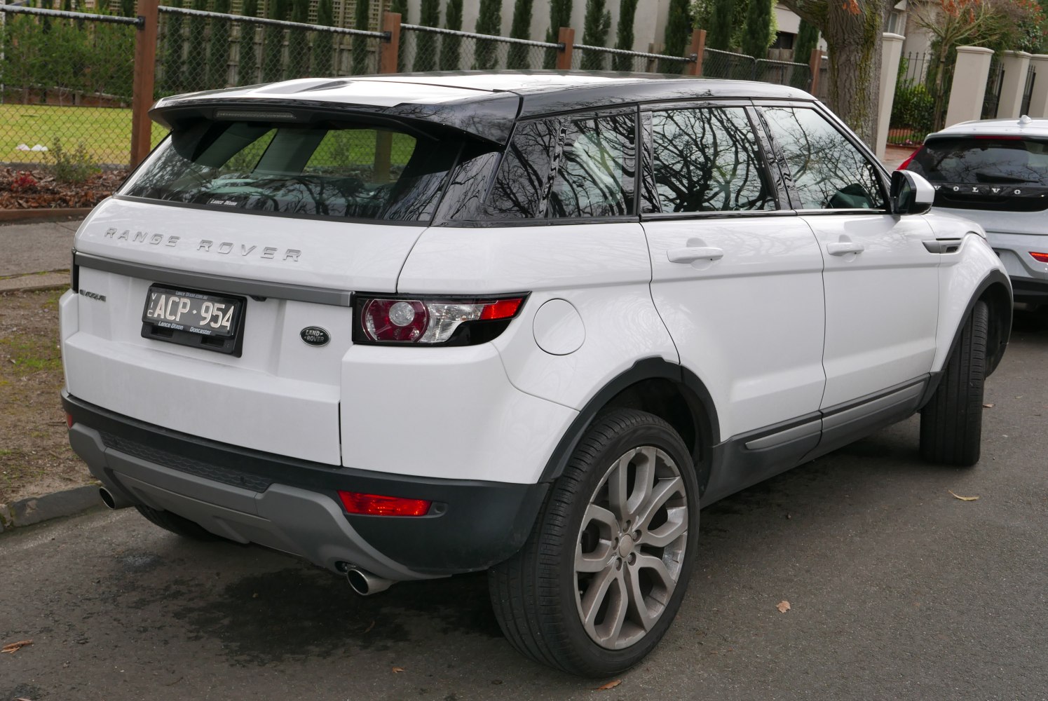 Rear view showcasing dual exhaust, signature taillights, sporty alloy wheels
