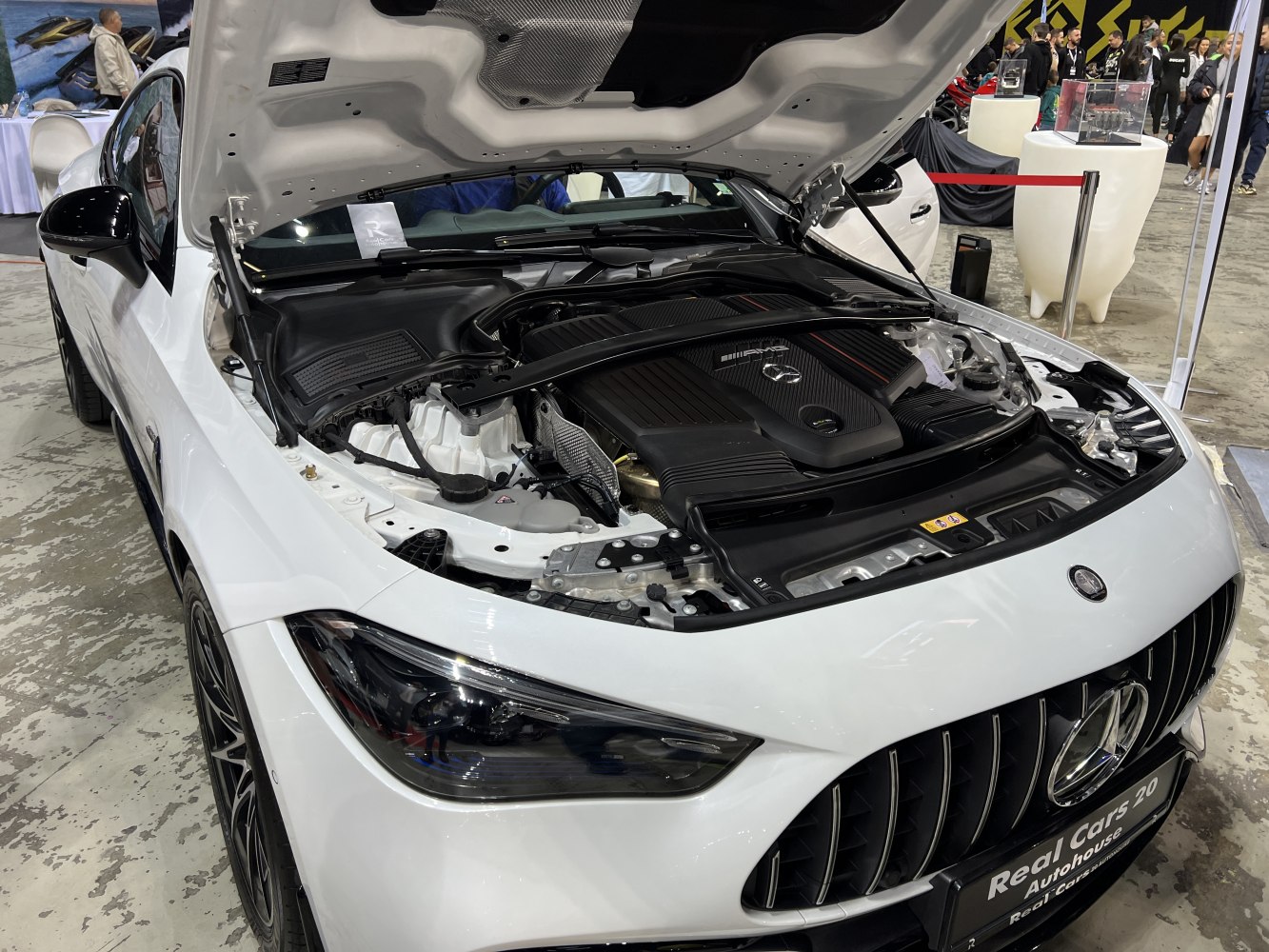 Engine bay with AMG cover and aggressive front grille