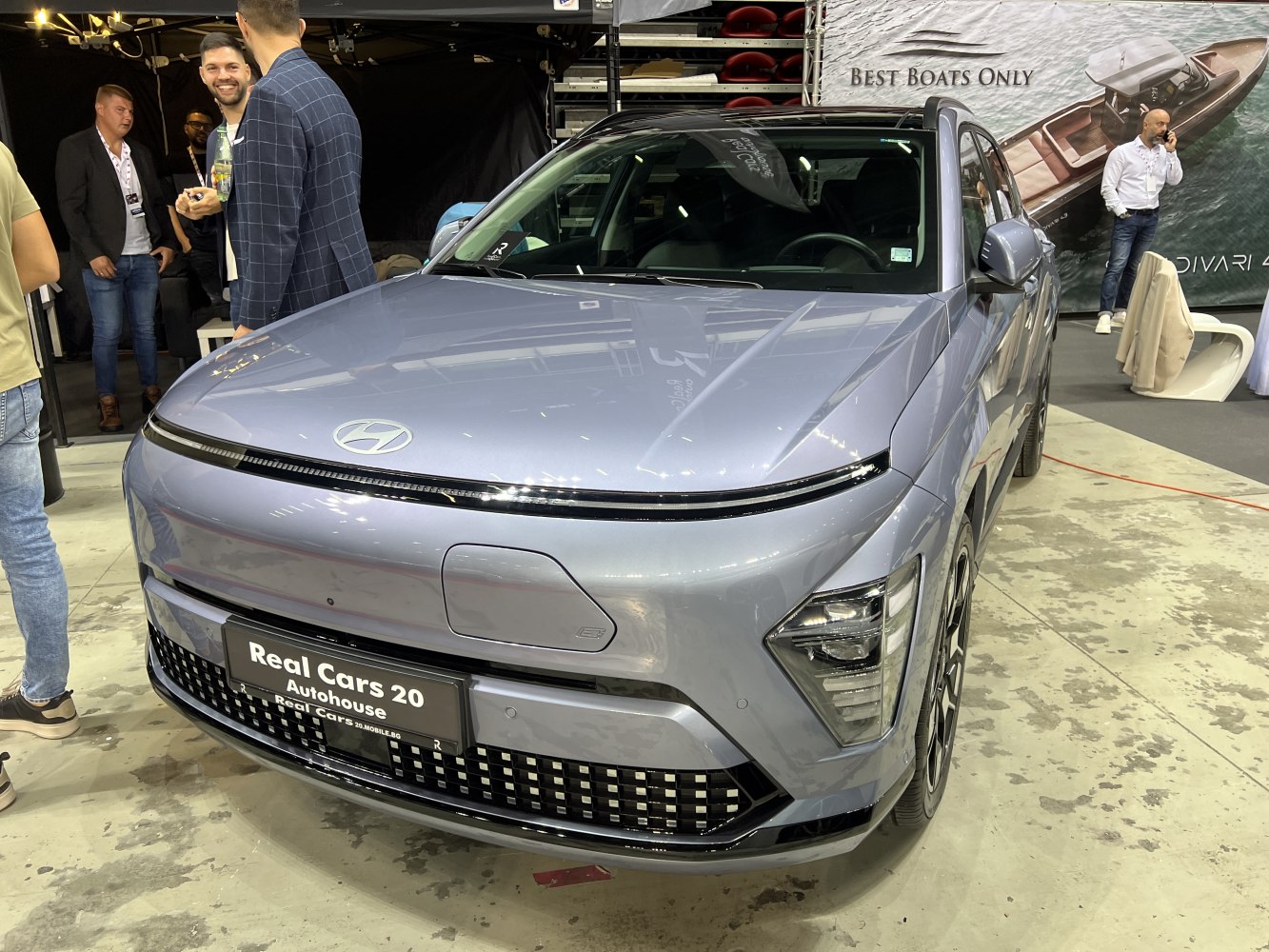 Front view of a modern electric SUV with LED headlights and sleek grille.