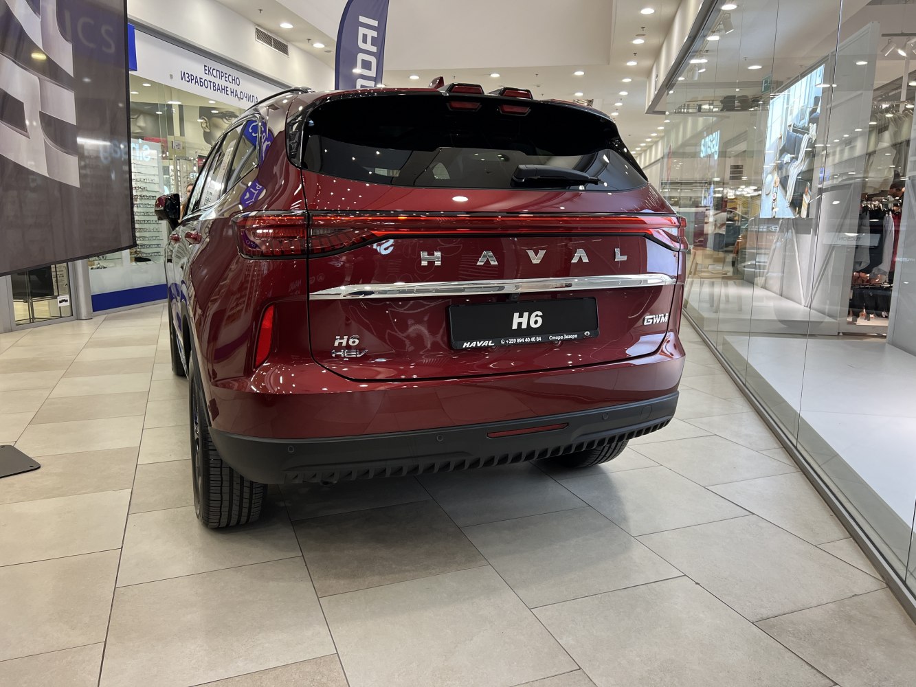 Rear view of H6 III with connected taillights and hybrid badge