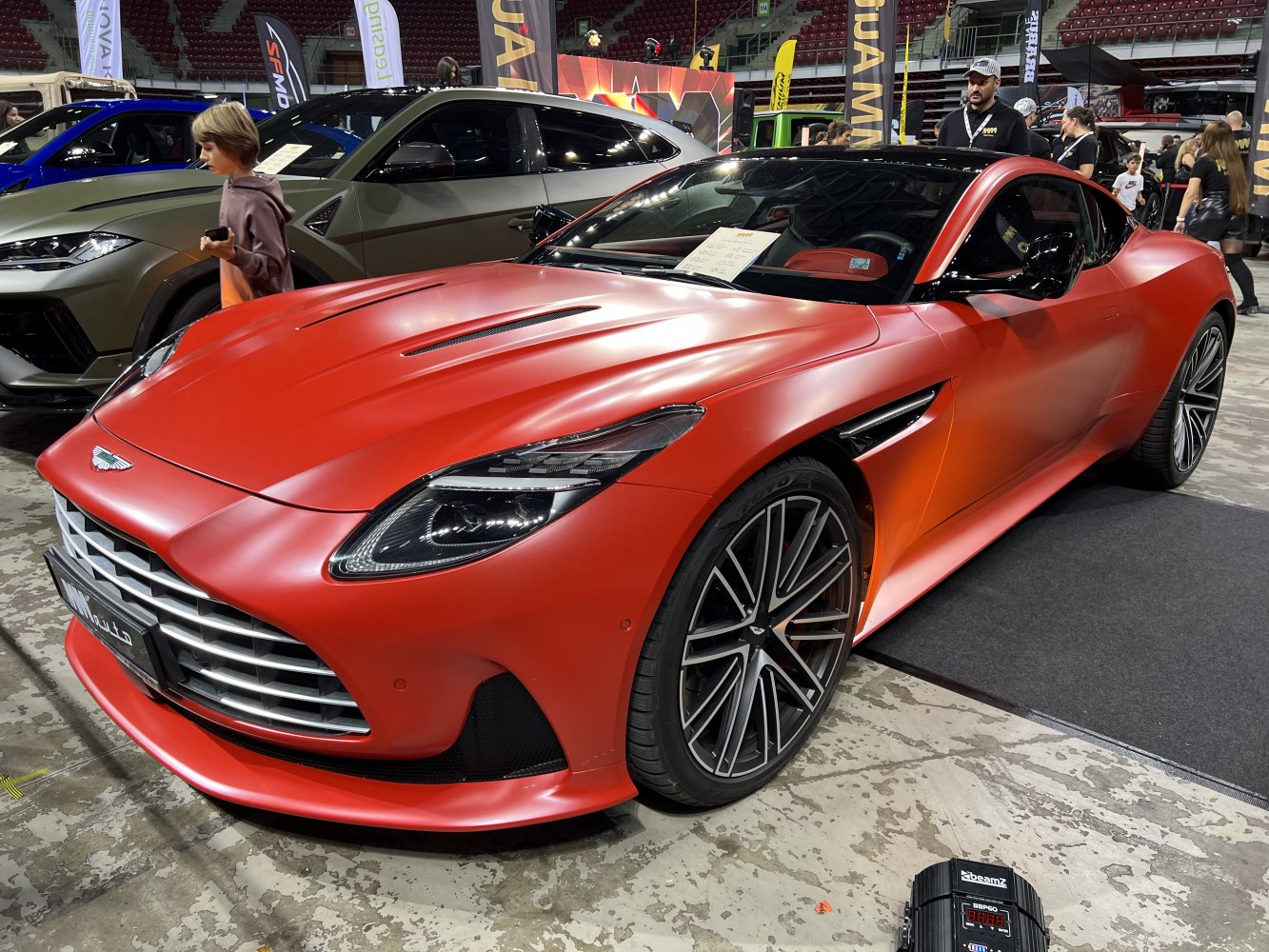 Aerodynamic hood vents and sleek headlights on a luxury coupe