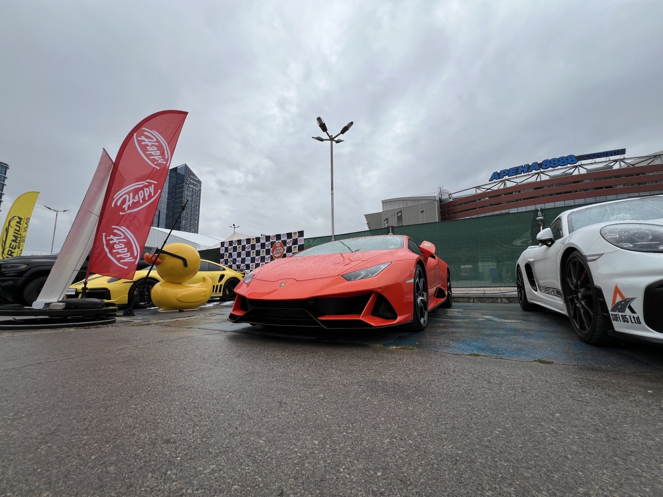 Aggressive front design and low stance of red Lamborghini Huracan EVO.