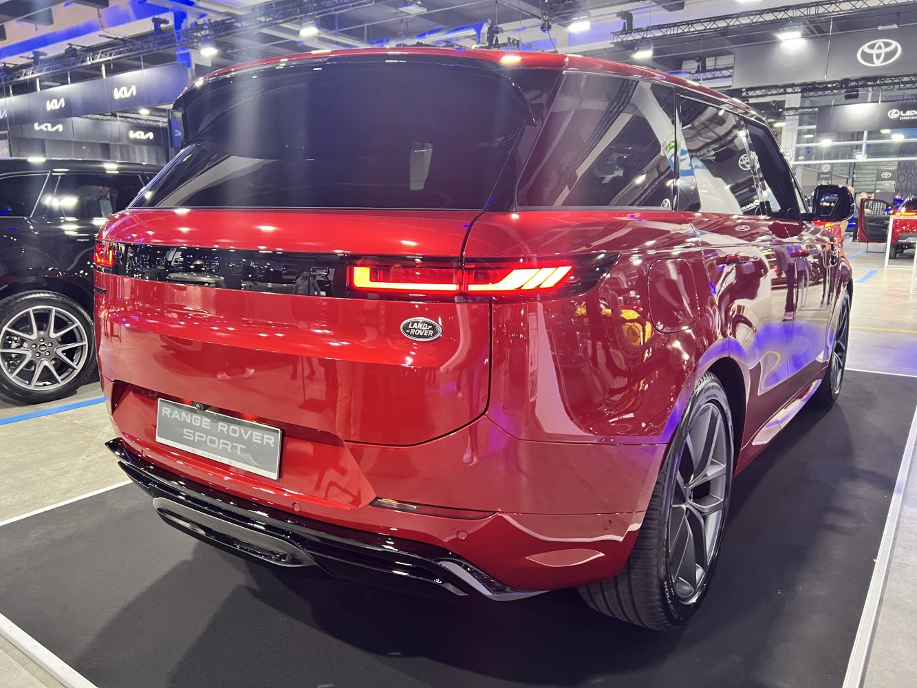 Rear view with modern tail lights and sleek red body