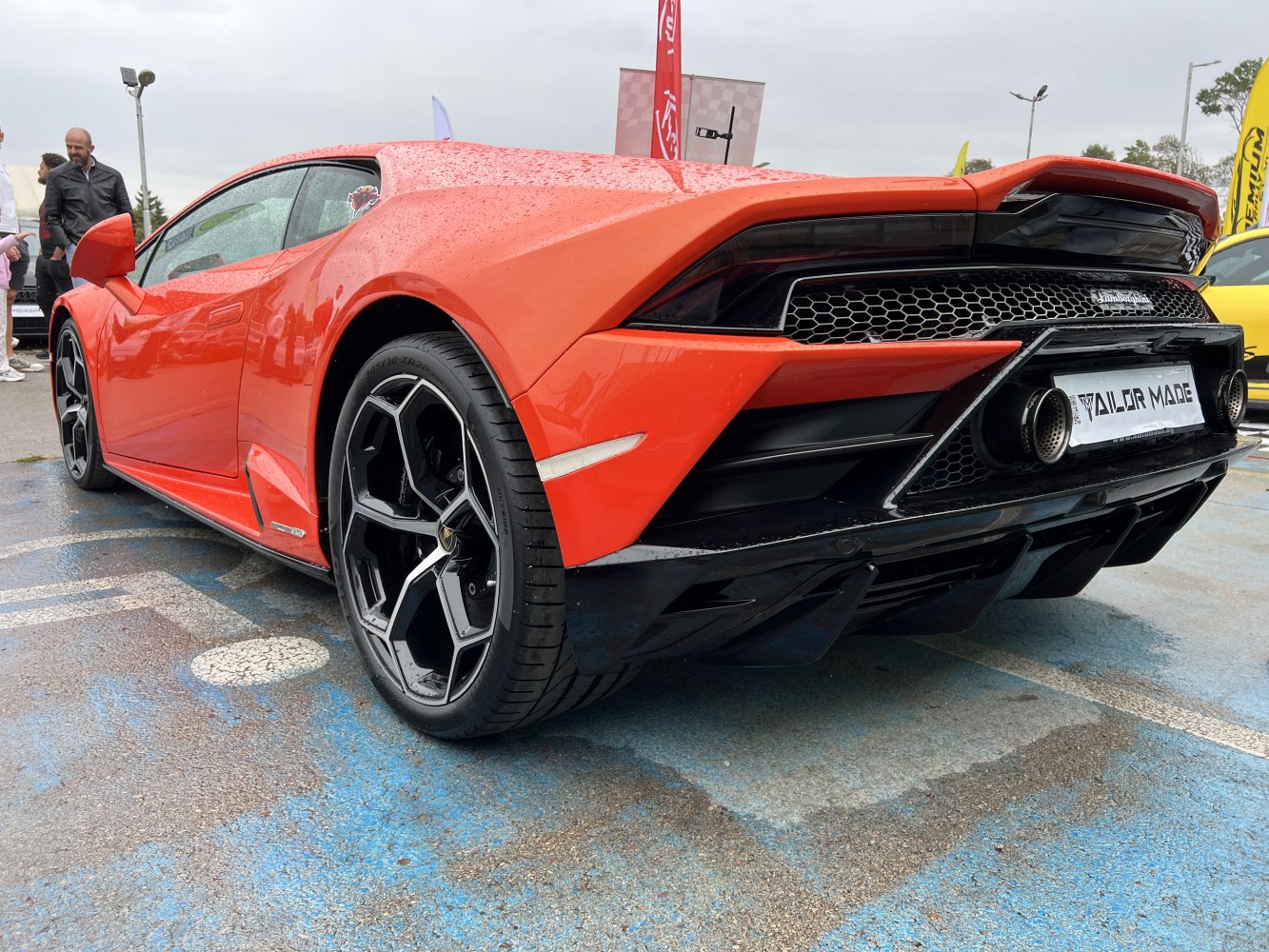 Rear wing, twin exhausts, unique alloy wheels, and rear diffuser.