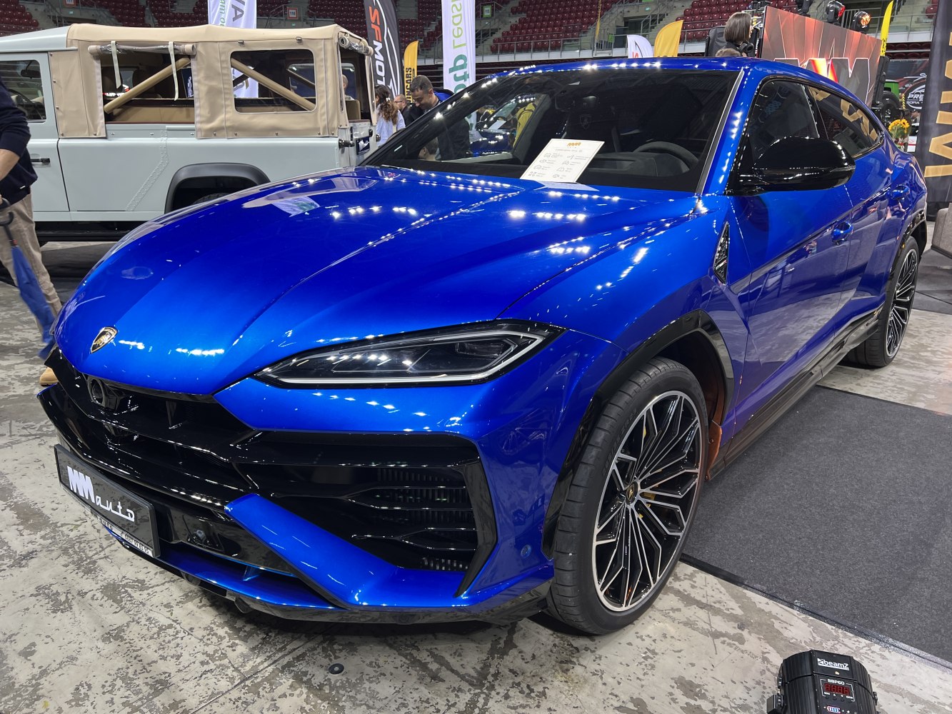 Blue SUV with LED headlights and multi-spoke wheels