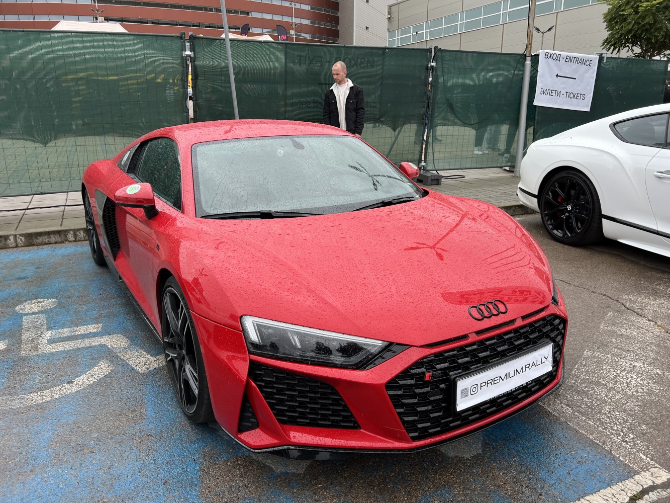 Red sports coupe with aggressive front grille and modern LED headlights