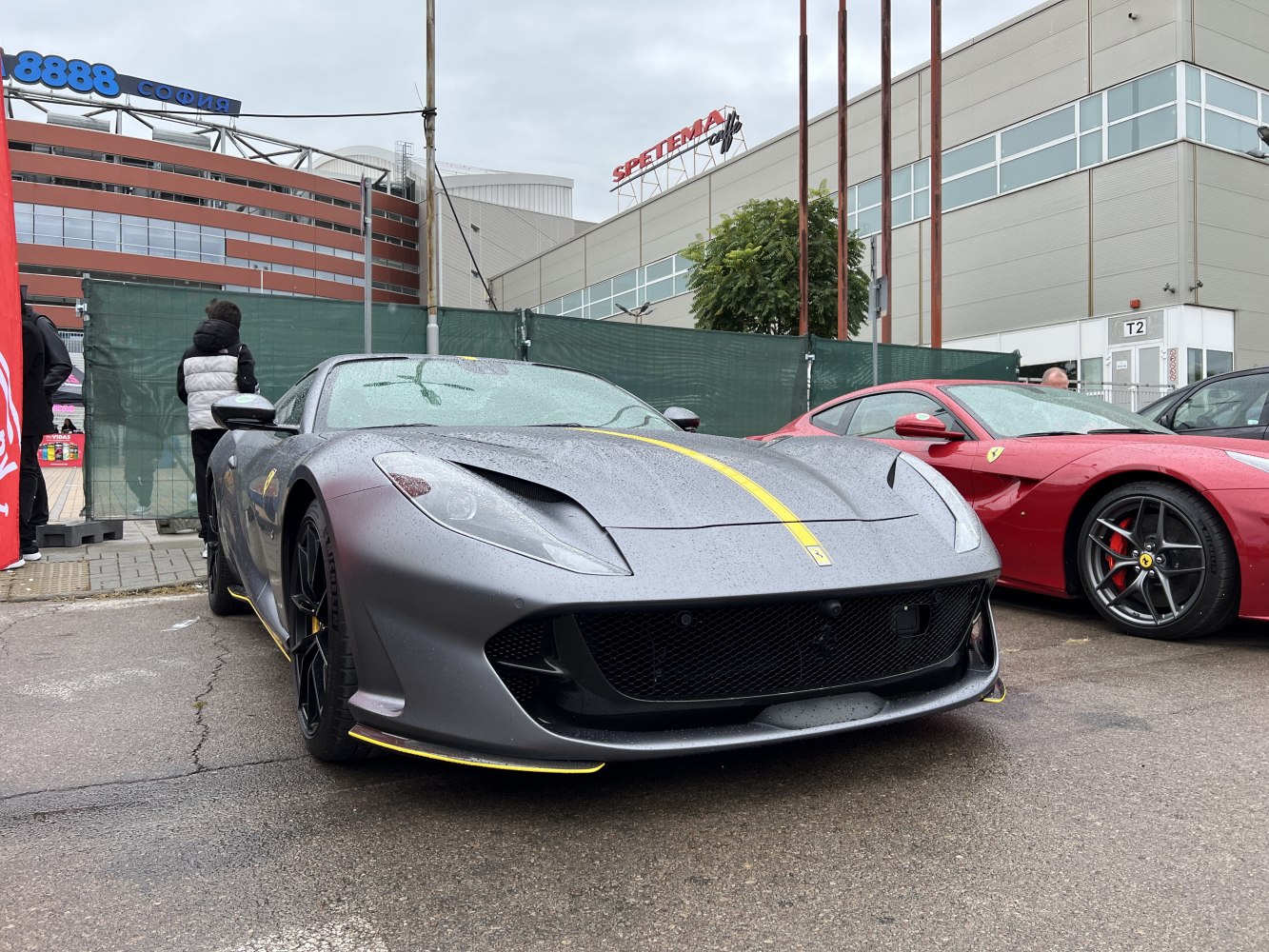 Front view of high-performance sports car with yellow racing stripe.