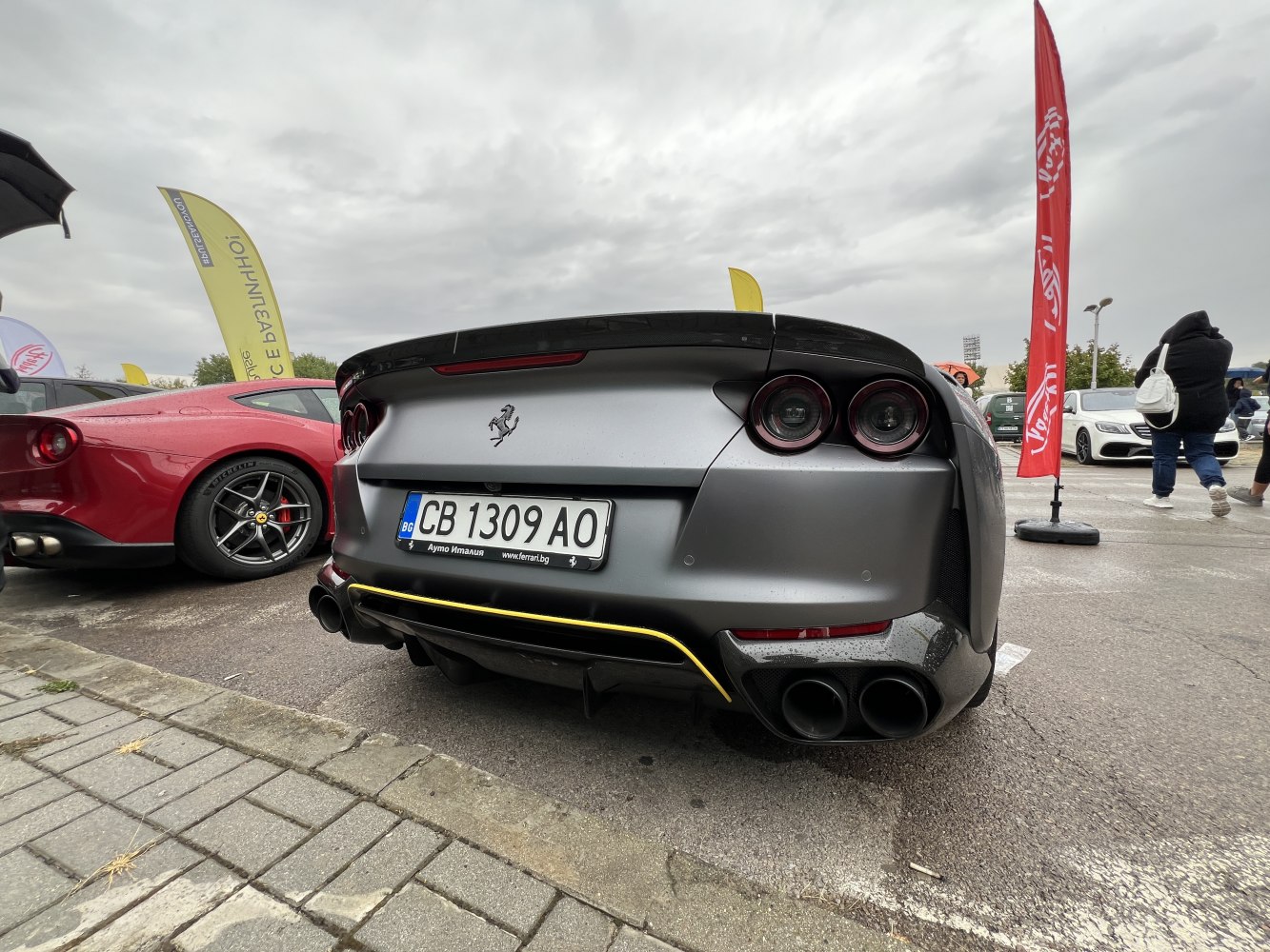 Rear view showing quad exhausts and circular taillights.