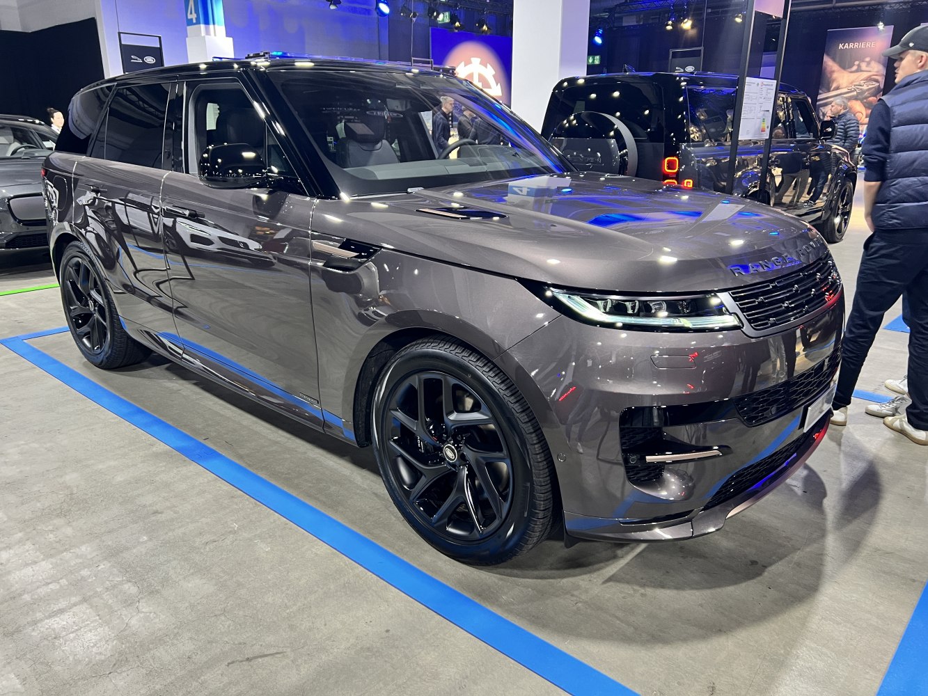 Front side view with sleek LED headlights and black alloy wheels