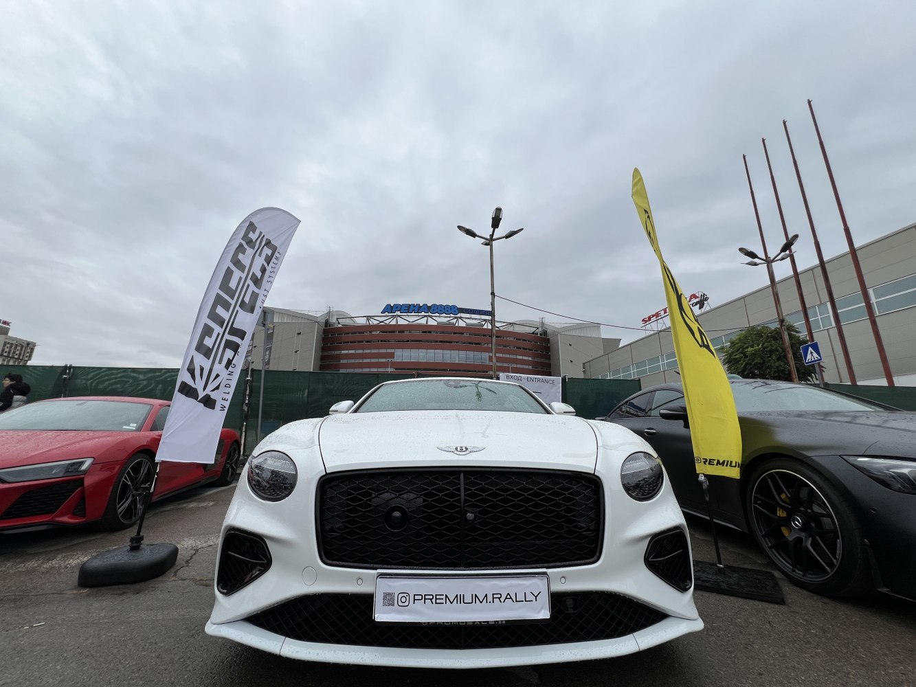 Front view of a luxury coupe with aggressive grille and sleek headlights