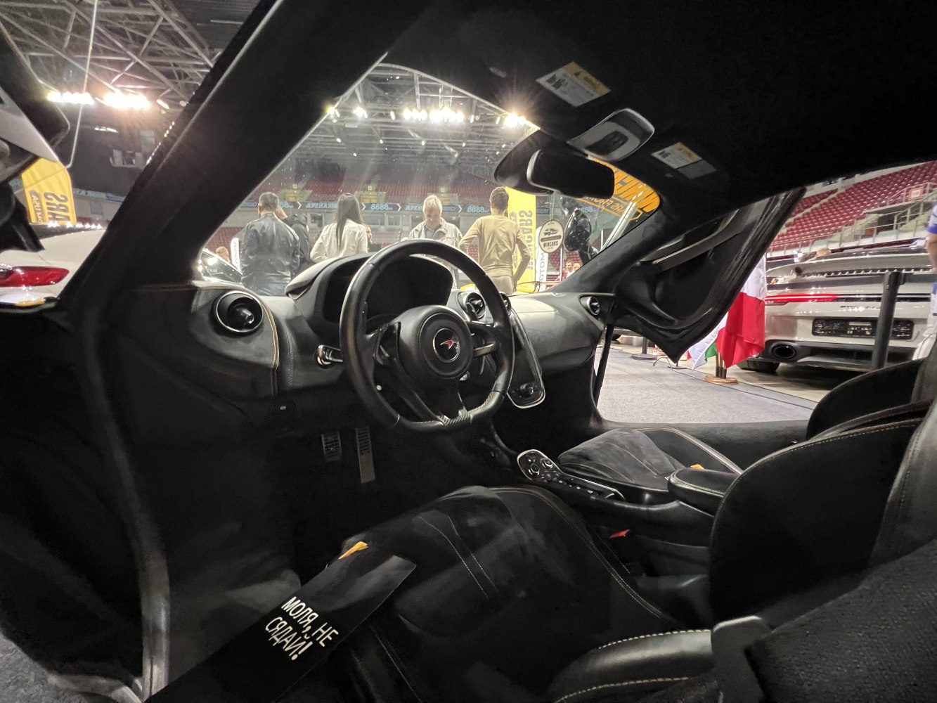 Dashboard, steering wheel, and sporty seats of a luxury sports car interior